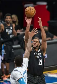  ?? (AP Photo/Corey Sipkin) ?? Brooklyn Nets center LaMarcus Aldridge (21) shoots over Los Angeles Lakers center Andre Drummond (2) during the first half of an NBA basketball game Saturday, April 10, 2021, in New York.