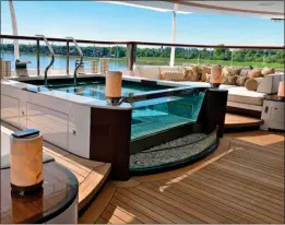  ?? ?? DeckeD out: The yacht has on-deck hot tub, above, and a pool