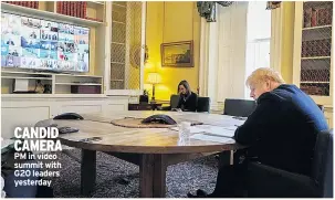  ??  ?? CANDID CAMERA PM in video summit with G20 leaders yesterday