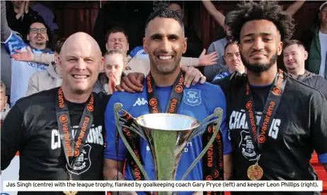  ?? ?? Jas Singh (centre) with the league trophy, flanked by goalkeepin­g coach Gary Pryce (left) and keeper Leon Phillips (right).