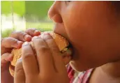  ??  ?? FAST FOOD: Hamburgers are enjoyed by adults and youngsters, but a balanced diet is important for good health.