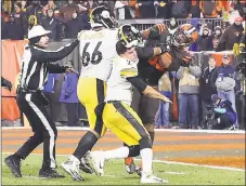  ?? Joshua Gunter, cleveland.com / Associated Press ?? Cleveland Browns defensive end Myles Garrett (95) hits Pittsburgh Steelers quarterbac­k Mason Rudolph (2) with a helmet during the second half on Thursday in Cleveland.