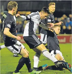  ?? SNS. ?? Lawrence Shankland fires home Ayr’s first goal.Picture: