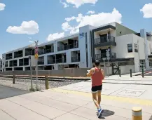  ?? LUIS SÁNCHEZ SATURNO/THE NEW MEXICAN ?? Barry Shulock, a resident of Railyard Flats, walks back to his residence Thursday. A report Wednesday from the National Low Income Housing Coalition says rents in this country, and in Santa Fe, are beyond the ability of minimum-wage workers to afford.