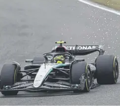  ?? ?? Sparks fly as Lewis Hamilton drives his Mercedes during practice