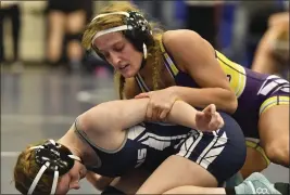  ?? MARC LEVY — THE ASSOCIATED PRESS ?? Palisades (Pa.) High wrestler Savannah Witt, top, competes in a semifinal match during the Southeast Regional wrestling tournament in Quakertown, Pa.