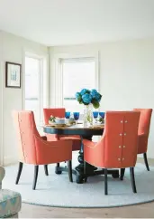  ?? JARED KUZIA ?? “The orange dining chairs in this airy waterfront dining room are from Kravet,” says Jillian Hayward Schaible, who adds it’s worth investing in pieces you sit, sleep and eat on.