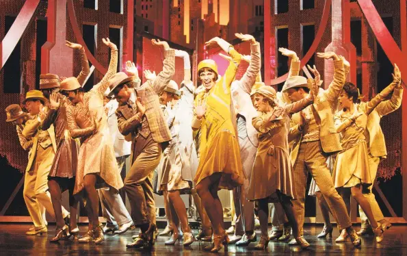  ??  ?? Marissa Follo Perry, of Beacon Falls, appears with Harvey Fierstein, who lives in Ridgefield, during the curtain call for the Broadway production of “Hairspray.” One of her Broadway favorites is “Thoroughly Modern Millie,” at top, with Sutton Foster.