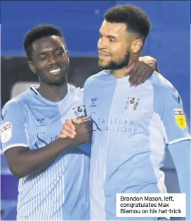  ??  ?? Brandon Mason, left, congratula­tes Max Biamou on his hat-trick