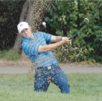  ?? — USA Today Sports ?? America’s Jordan Spieth hits out of a sand trap on the second hole during the third round at Conway Farms Golf Club. The 22-year-old American, who has had an up-close view of Day’s domination, wants some payback and believes he can return to top form...