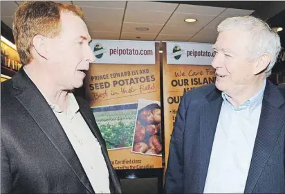  ?? HEATHER TAWEEL/THE GUARDIAN ?? Kevin MacIsaac, left, general manager, and Ray Keenan, chairman, United Potato Growers of Canada, chat during a break of the 2016 United Potato Partners Seminar held at Red Shores Race Track and Casino in Charlottet­own Wednesday.