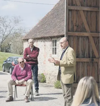  ??  ?? Arundel and South Downs MP Andrew Griffith discusses issues with local farmers