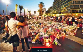  ??  ?? In the days following the attack, residents were drawn to a makeshift memorial on the Promenade