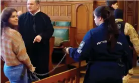  ?? ?? A chained Ilaria Salis is led into the Budapest courtroom. Photograph: tgcom24