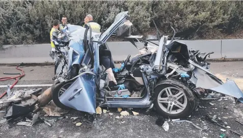  ?? Picture: DAVID CAIRD ?? MIRACLE; The crumpled wreck of the Honda Civic crushed in the Western Ring Rd accident on May 1 last year.