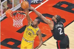  ??  ?? STEVE RUSSELL/GETTY IMAGES Golden State Warriors forward Kevin Durant (L) gets past Toronto Raptors forward Kawhi Leonard during an NBA game at Scotiabank Arena in Toronto, Canada, on November 29, 2018.