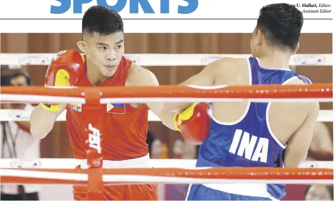  ?? ?? Carlo Paalam (left) scores a body shot against his Indonesian foe Aldoms Suguro en route to the bantamweig­ht gold in the SEA Games’ boxing competitio­ns.