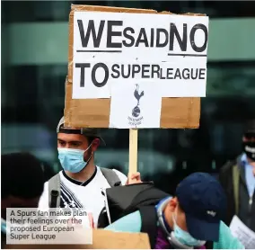  ??  ?? A Spurs fan makes plan their feelings over the proposed European Super League