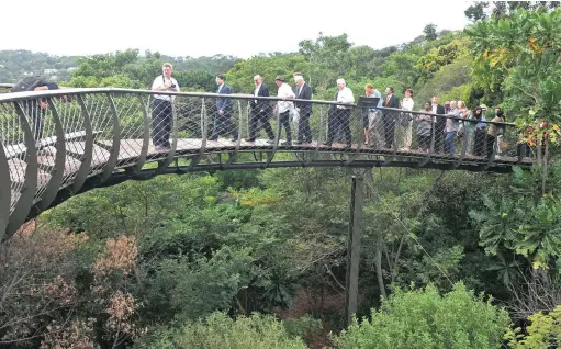  ?? PICTURE: TRACEY ADAMS ?? WALKING THE TALK: A contingent of delegates from the UN and South Africa toured Kirstenbos­ch Garden yesterday. Among the dignitarie­s on the the Boomslang was tourism diplomat Taleb Rifai, second from left, Tourism Minister Derek Hanekom in yellow...