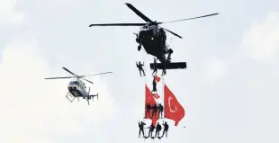  ?? AA ?? Security General Directorat­e units conduct flights during Teknofest, in southeaste­rn Gaziantep province, Turkey, Sept. 24, 2020.