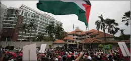  ??  ?? Protesters wave Palestinia­n flags during a protest outside the US embassy in Kuala Lumpur, Malaysia’s capital, yesterday.