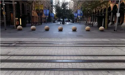  ?? Photograph: Mick Tsikas/EPA ?? A near empty Martin Place. With the Sydney lockdown likely to be extended, the federal government has signed off on a Covid support package for affected businesses and households.