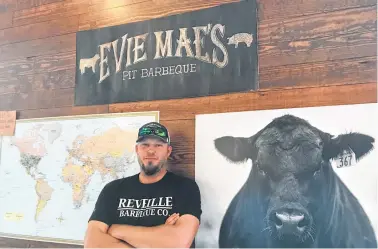  ?? Mary Ann Anderson / Tribune News Service ?? Arnis Robbins of Evie Mae’s Pit Barbecue slow cooks the brisket for more than 16 hours. On some days, the restaurant sells out of brisket and other barbecue goodness before midafterno­on.