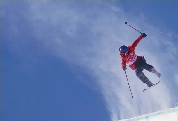  ?? Patrick Smith / Getty Images ?? Eileen Gu, raised in San Francisco and headed to Stanford, goes through her gold-medal routine in the women’s halfpipe at the Beijing Games on Friday.