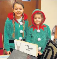  ??  ?? Helpers Evie and Izzie Carmichael at the BRCFC 2006 team’s Christmas fair on Saturday