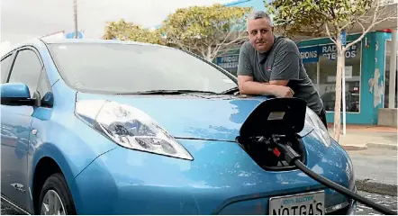  ?? PHOTO: CAMERON BURNELL/STUFF ?? Tawa resident Nathan Murrell has driven his Nissan Leaf around Wellington for 18 months, and says the car is perfect for the capital.