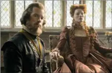  ?? ASSOCIATED PRESS ?? This image released by Focus Features shows Guy Pearce stars as William Cecil, left, and Margot Robbie as Queen Elizabeth in a scene from “Mary Queen of Scots.”