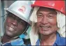  ?? YU HAI / FOR CHINA DAILY ?? Niger Refinery of the Belt and Road Project — master and local apprentice of PetroChina, June 19, 2011.