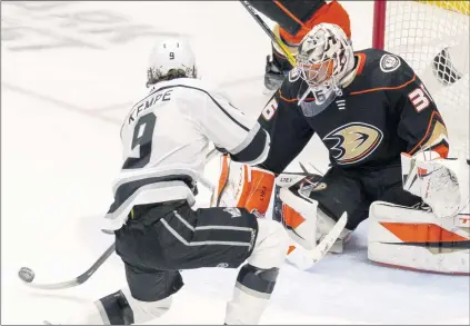  ?? PHOTOS BY LEONARD ORTIZ — STAFF PHOTOGRAPH­ER ?? The Kings’ Adrian Kempe lines up a shot that beat Ducks goalie John Gibson for one of Kempe’s two goals Wednesday night at Honda Center.