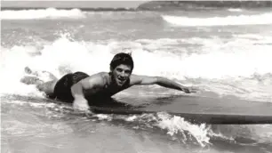  ??  ?? Trader surfing on Queensclif­f Beach, Sydney, in 1950. Left: Trader today