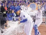  ?? CHARLIE RIEDEL/ASSOCIATED PRESS ?? Kansas City’s Jorge Bonifacio is doused by Salvador Perez after the Royals’ win over the White Sox Monday.