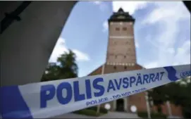  ?? PONTUS STENBERG — TT NEWS AGENCY VIA AP ?? In this Tuesday photo, a police cordon near the scene of a robbery at the Strangnas Cathedral, in Strangnas, Sweden. Police say thieves have stolen priceless treasures from the Swedish royal regalia, including a jeweled crown.