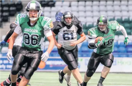  ?? Tim Furfie ?? Halton Spartans running back Dan Morris aims to dash upfield against the Morecambe Bay Storm during Sunday afternoon’s encounter at the Select Security Stadium.