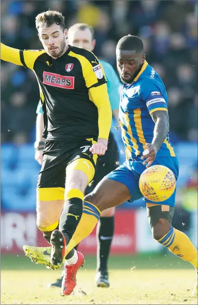  ??  ?? TANGLED UP: Rotherham’s Anthony Forde and Abu Ogogo fight for the ball