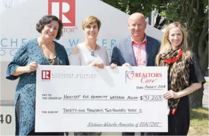  ??  ?? From Left: Karen Coviello CEO of Habitat for Humanity Waterloo Region, Tracey Appleton Chair of Habitat for Humanity Waterloo Region, Tony Schmidt President of KWAR &amp; Megan Bell 2018 Golf Tournament Chair.