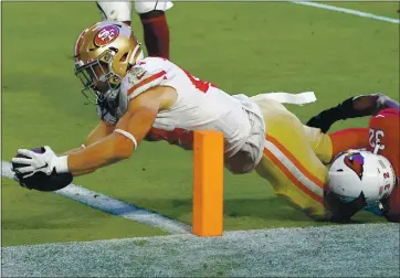  ?? RICK SCUTERI – THE ASSOCIATED PRESS ?? Fullback Kyle Juszczyk of the 49ers dives into the end zone for one of his two second-half touchdown receptions.