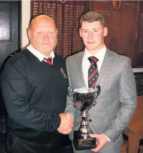  ??  ?? Andrew Owens with former club president Ged Snee after winning the League Cup