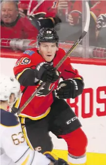  ?? LEAH HENNEL ?? Flames forward Matthew Tkachuk celebrates on Tuesday after scoring his first NHL goal on Buffalo Sabres goalie Robin Lehner.