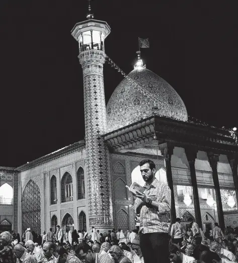  ?? TNS file photo ?? Worshipper­s pray at the Aramgah-e Shah-e Cheragh shrine in Shiraz, Iran, a city celebrated as the heartland of Persian culture.