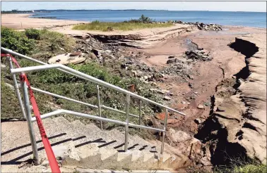  ?? Arnold Gold / Hearst Connecticu­t Media ?? Beach destructio­n caused by heavy rains Thursday near Lake Street and Ocean Avenue in West Haven.