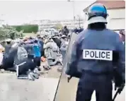  ??  ?? Police tackle students in film claiming to be of protests at Mantes-la-jolie