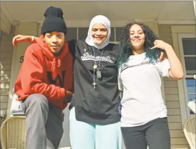  ?? Cassandra Day / Hearst Connecticu­t Media ?? Nur Fitzpatric­k, center, has been helping Dwayne, 23, left, and Angie, 16, along with several other homeless young people in Middletown.