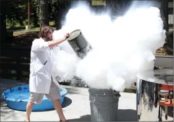  ?? The Sentinel-Record/Rebekah Hedges ?? SCIENCE FUN: Jeremy Mackey, director of education at Mid-America Science Museum, uses liquid nitrogen to demonstrat­e pressure Saturday during the sixth annual Tinkerfest at the museum.