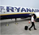  ?? — Reuters ?? A pilot disembarks a Ryanair flight at Stansted airport in London.