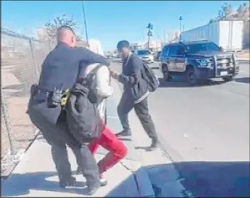  ?? @notbilly Twitter ?? A screenshot of a video showing an incident between a CCSD police officer and who appears to be a student outside of Durango High School on Feb. 9, 2023.