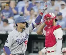  ?? ?? MOOKIE BETTS set the tone with a leadoff home run, his 26th homer of the season, as the Dodgers scored five first-inning runs.